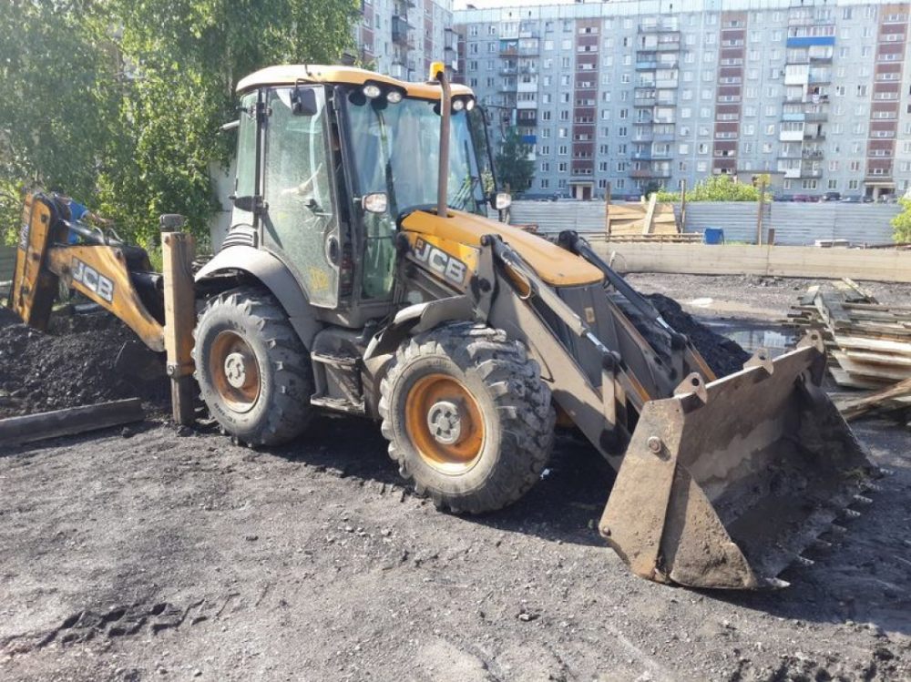 Услуги спецтехники для разравнивания грунта и насыпи стоимость услуг и где заказать - Архангельск